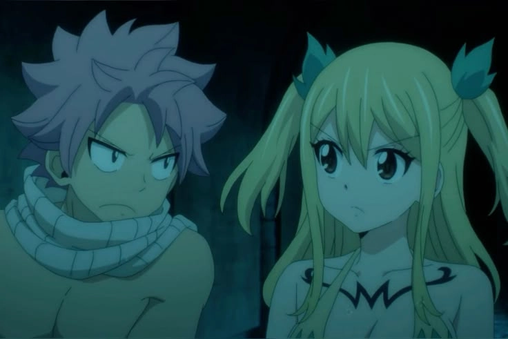 Lucy và Natsu nắm tay nhau giữa thế giới hỗn loạn